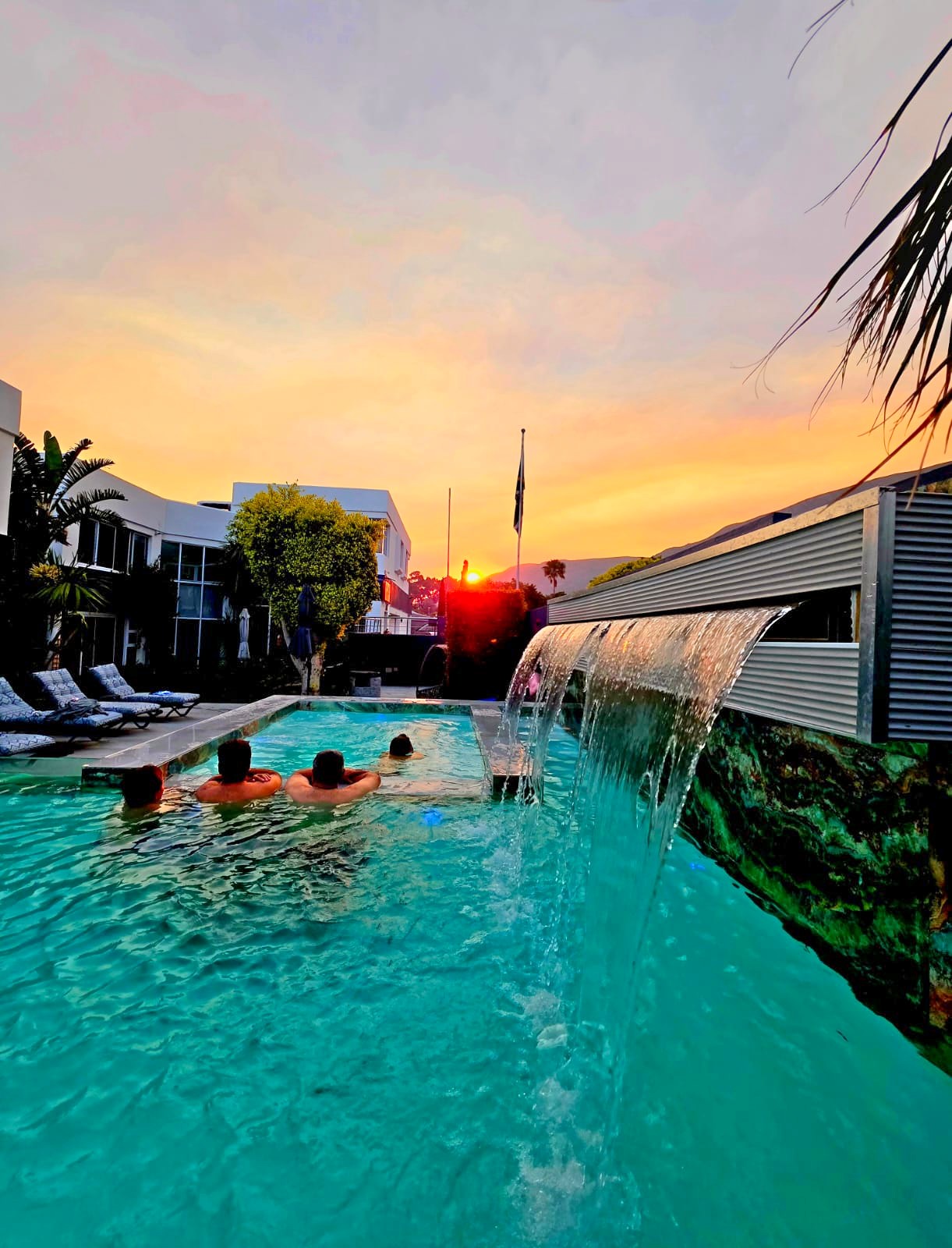 Sunset over the mountain from the pool